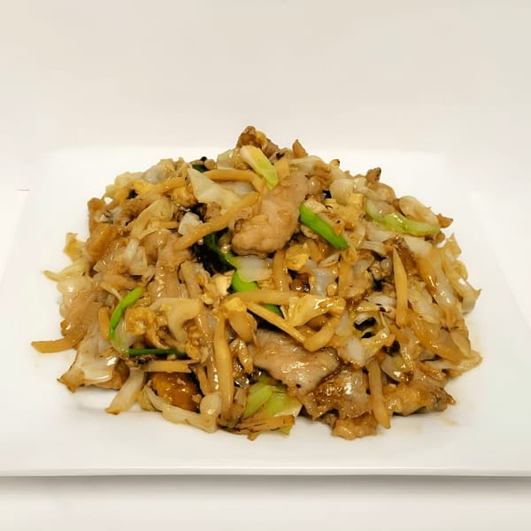 Double Happy's Chinese stir-fried noodles with pork, cabbage, and green onions on a white plate.